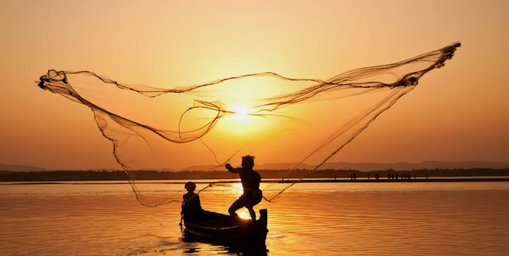 Fishermen casting net